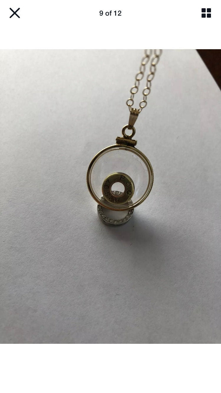 40 cal bullet necklace with floating amethyst Vintage 12k gold filled locket