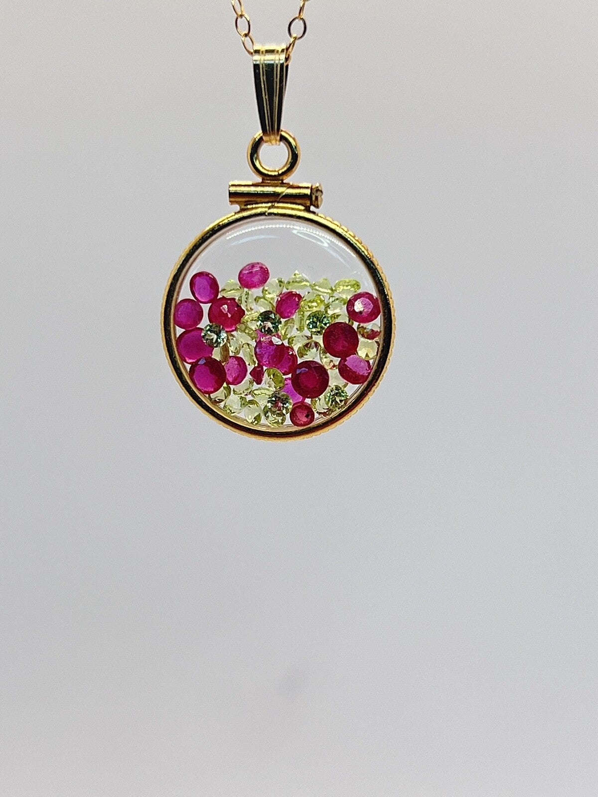 14k gold filled dime size Lucite Shaker Locket with Rubies and Peridot