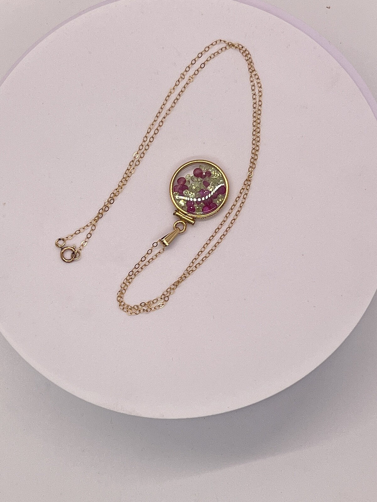 14k gold filled dime size Lucite Shaker Locket with Rubies and Peridot