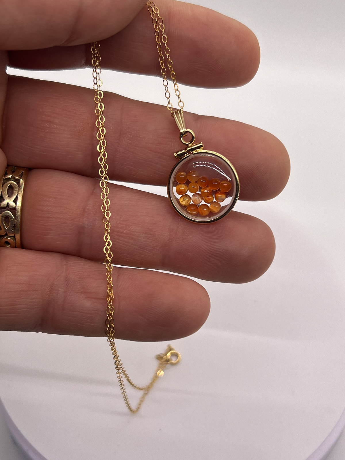 14k gold filled dime size Lucite Shaker Locket with Carnelian cabochons