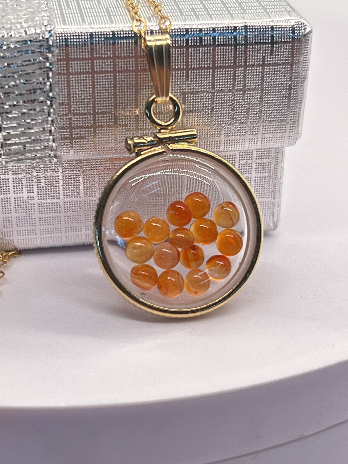 14k gold filled dime size Lucite Shaker Locket with Carnelian cabochons