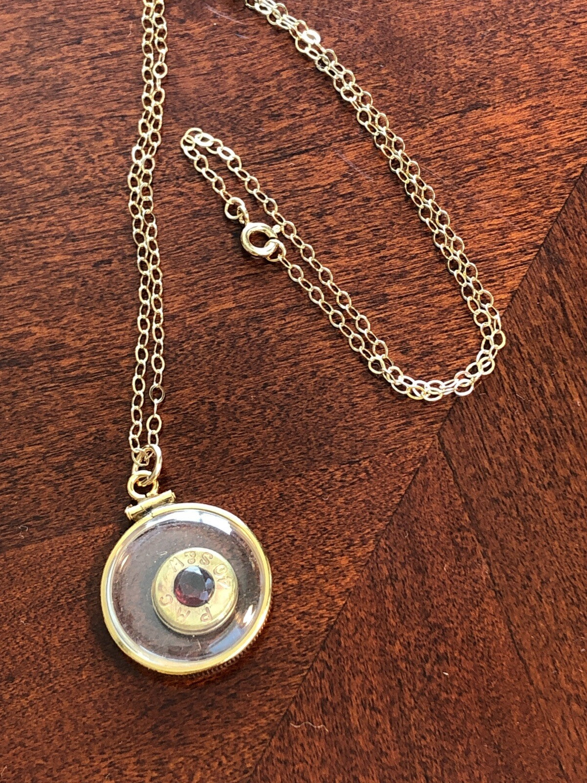 40 cal bullet necklace with 5 mm Garnet, Vintage 12k gold filled locket