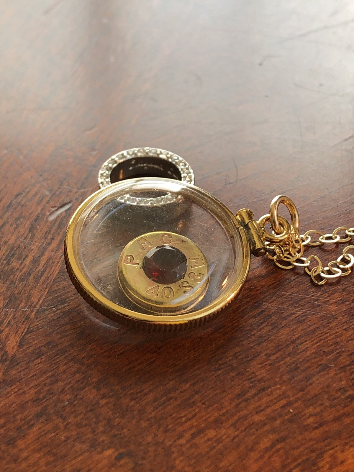 40 cal bullet necklace with 5 mm Garnet, Vintage 12k gold filled locket