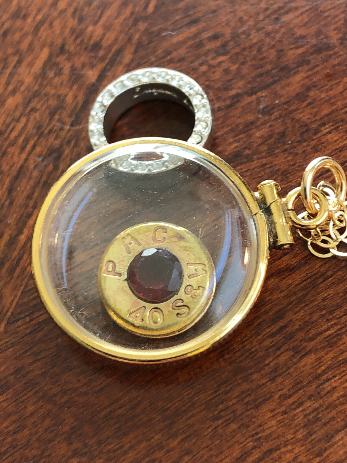 40 cal bullet necklace with 5 mm Garnet, Vintage 12k gold filled locket