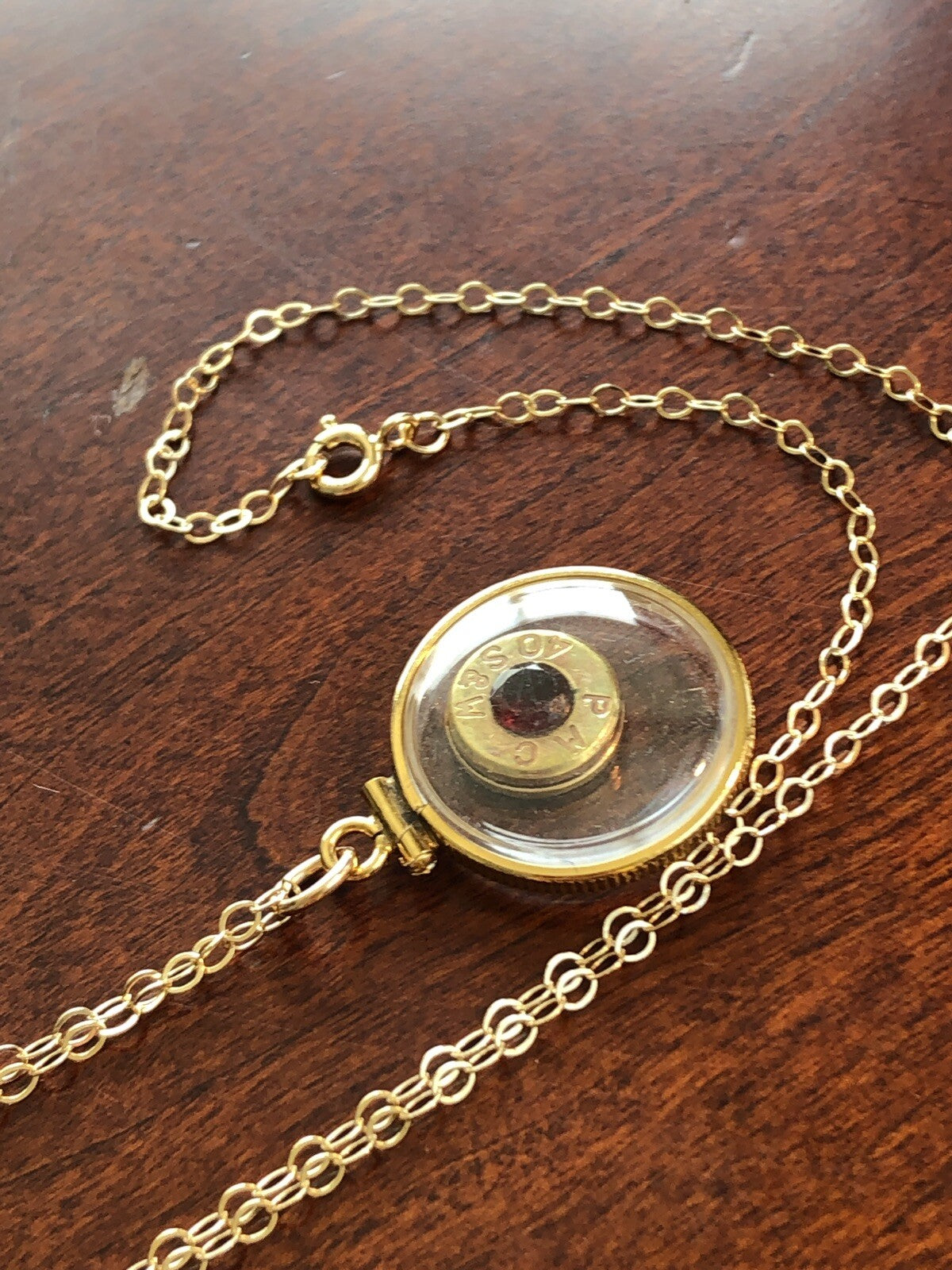 40 cal bullet necklace with 5 mm Garnet, Vintage 12k gold filled locket