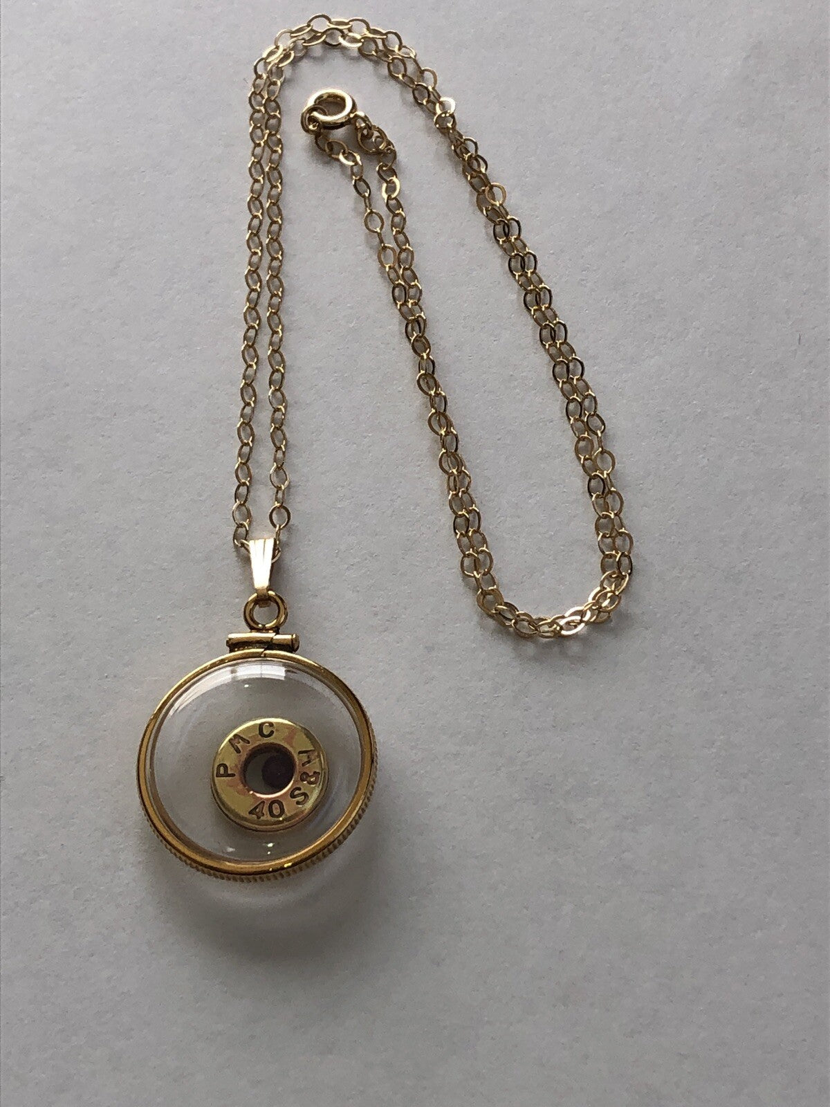 40 cal bullet necklace with floating amethyst Vintage 12k gold filled locket