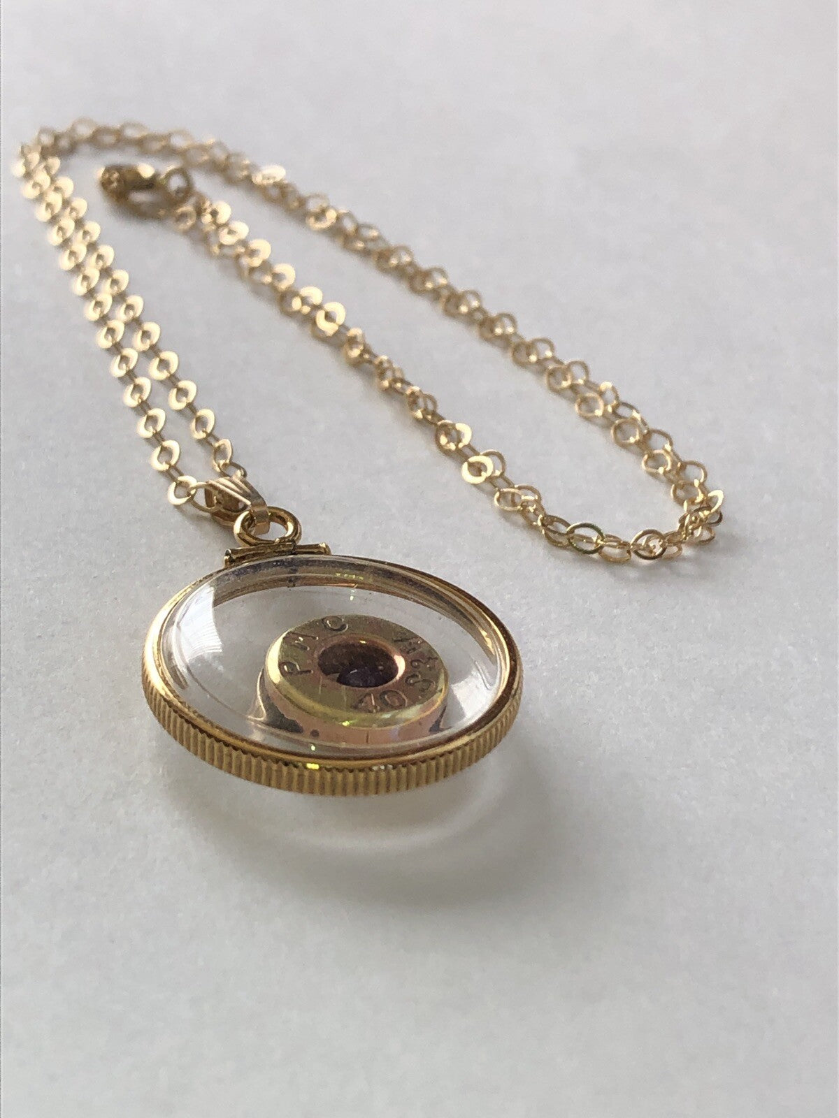 40 cal bullet necklace with floating amethyst Vintage 12k gold filled locket