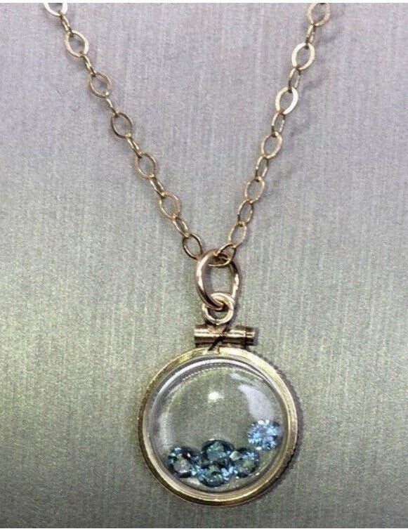 Vintage 12k gold filled shaker locket with five round cut 3mm Topaz gemstones