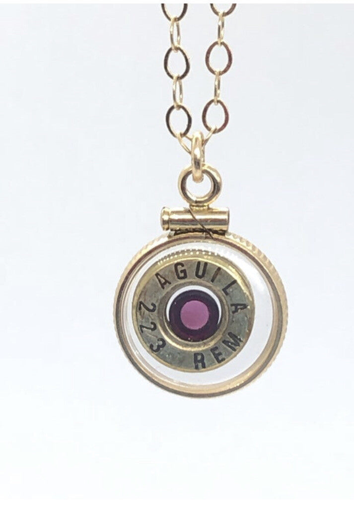 Handmade 14k gold filled .223 cal bullet view locket, with a genuine garnet