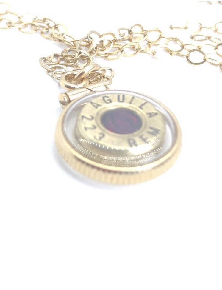 Handmade 14k gold filled .223 cal bullet view locket, with a genuine garnet
