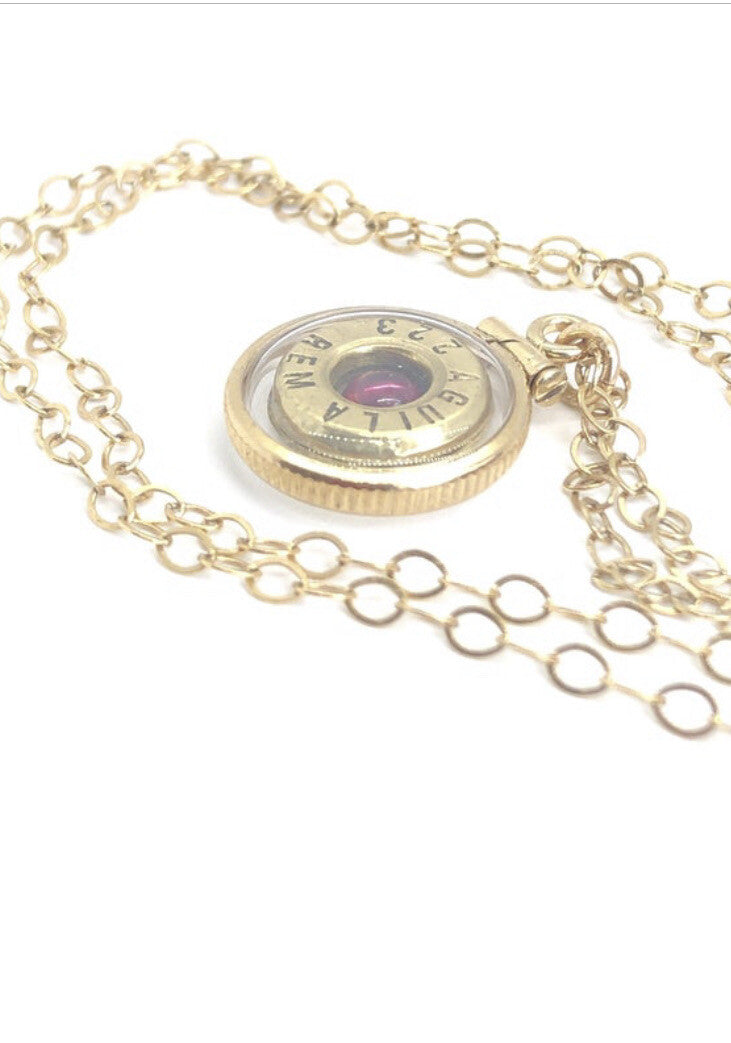 Handmade 14k gold filled .223 cal bullet view locket, with a genuine garnet