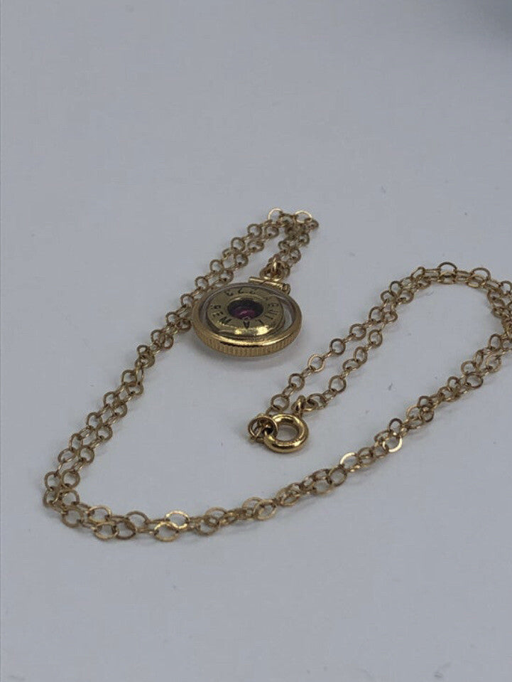 Handmade 14k gold filled .223 cal bullet view locket, with a genuine garnet