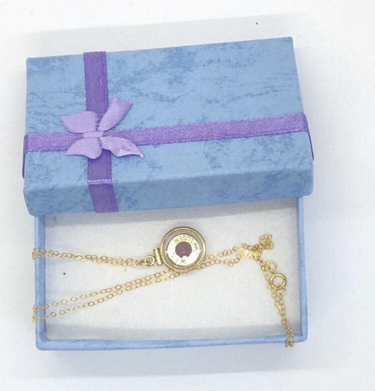 Handmade 14k gold filled .223 cal bullet view locket, with a genuine garnet