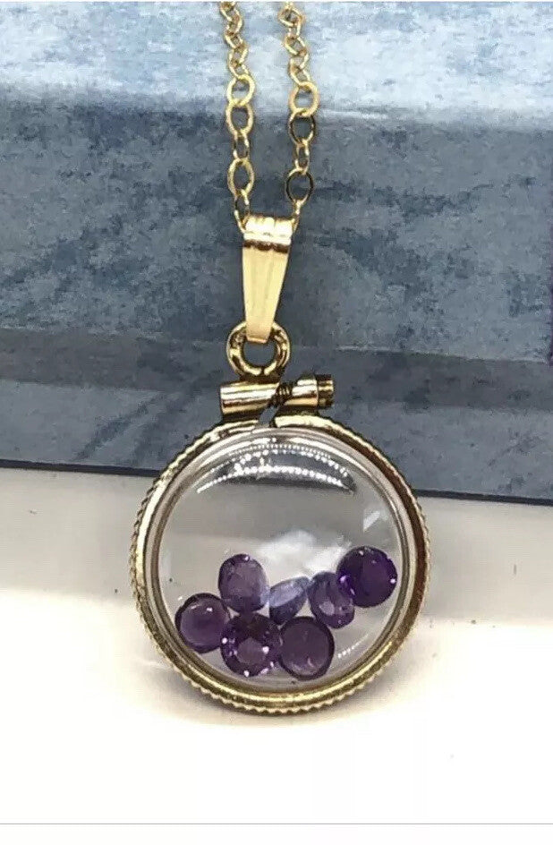 15 mm Vintage 12k gold filled locket with 7 ,3mm beautiful cut amethyst 0.7 tcw