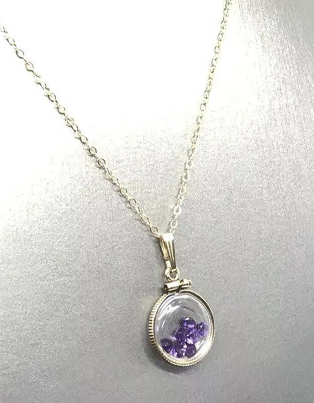 15 mm Vintage 12k gold filled locket with 7 ,3mm beautiful cut amethyst 0.7 tcw