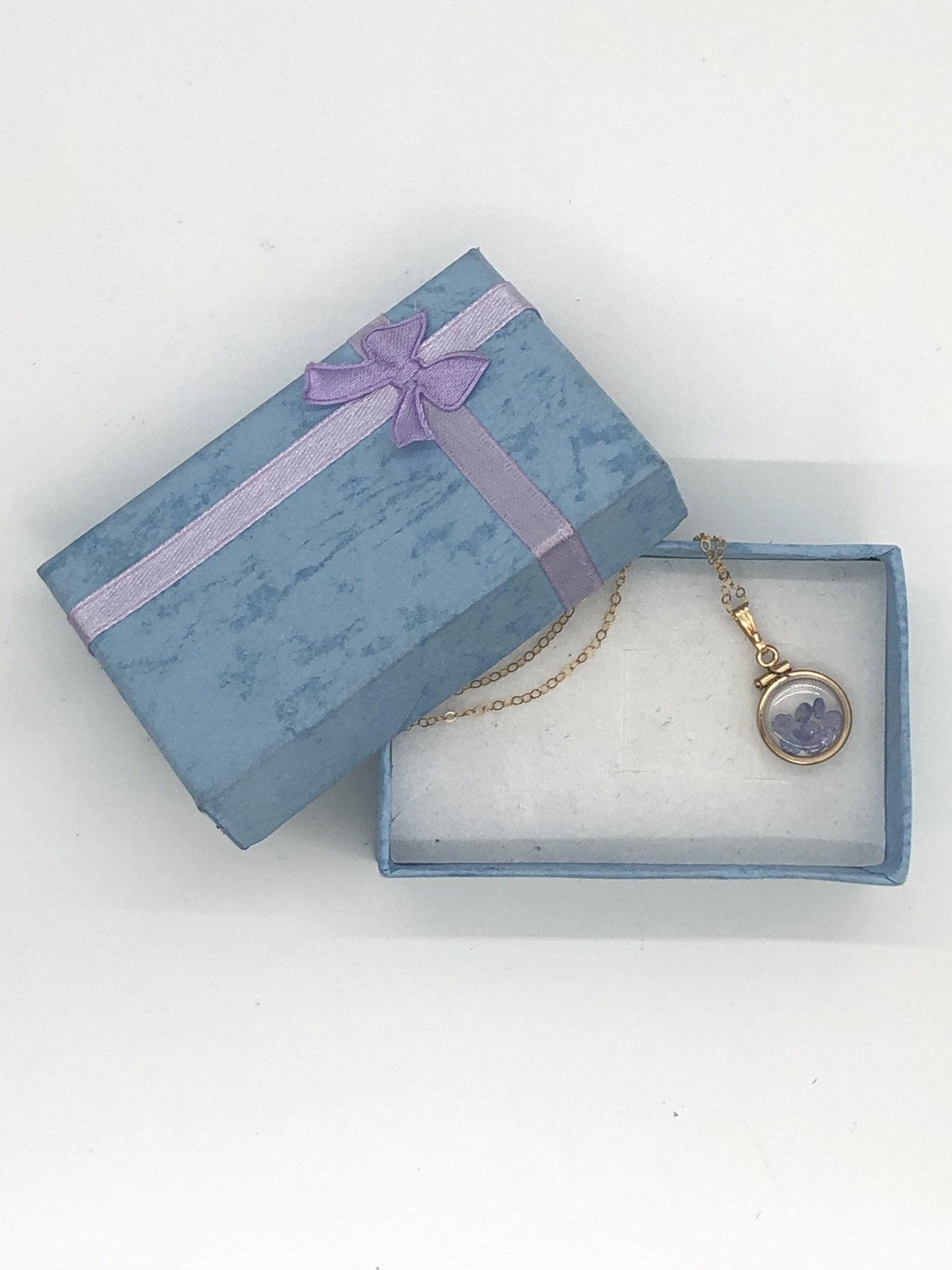 Diminutive tanzanite shaker locket 14k gf or silver with beautiful december birthstone, .9tcw round cut gems
