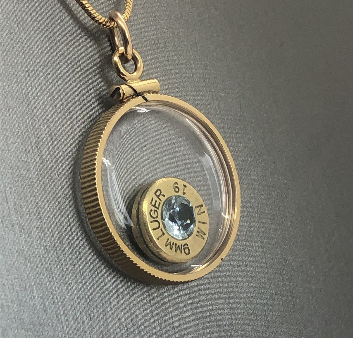 Handmade 9mm bullet w/Aquamarine or tourmaline , back to back view locket, 14k gold filled locket-new with floating faceted gem.