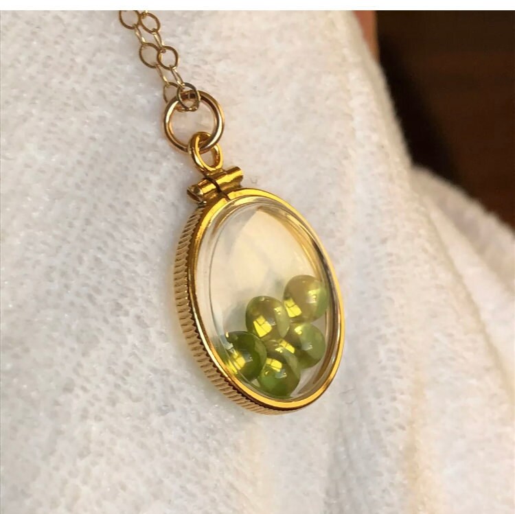 Vintage 12k gold filled locket with five 5mm beautiful green peridot cabochons, 3.26 TCW