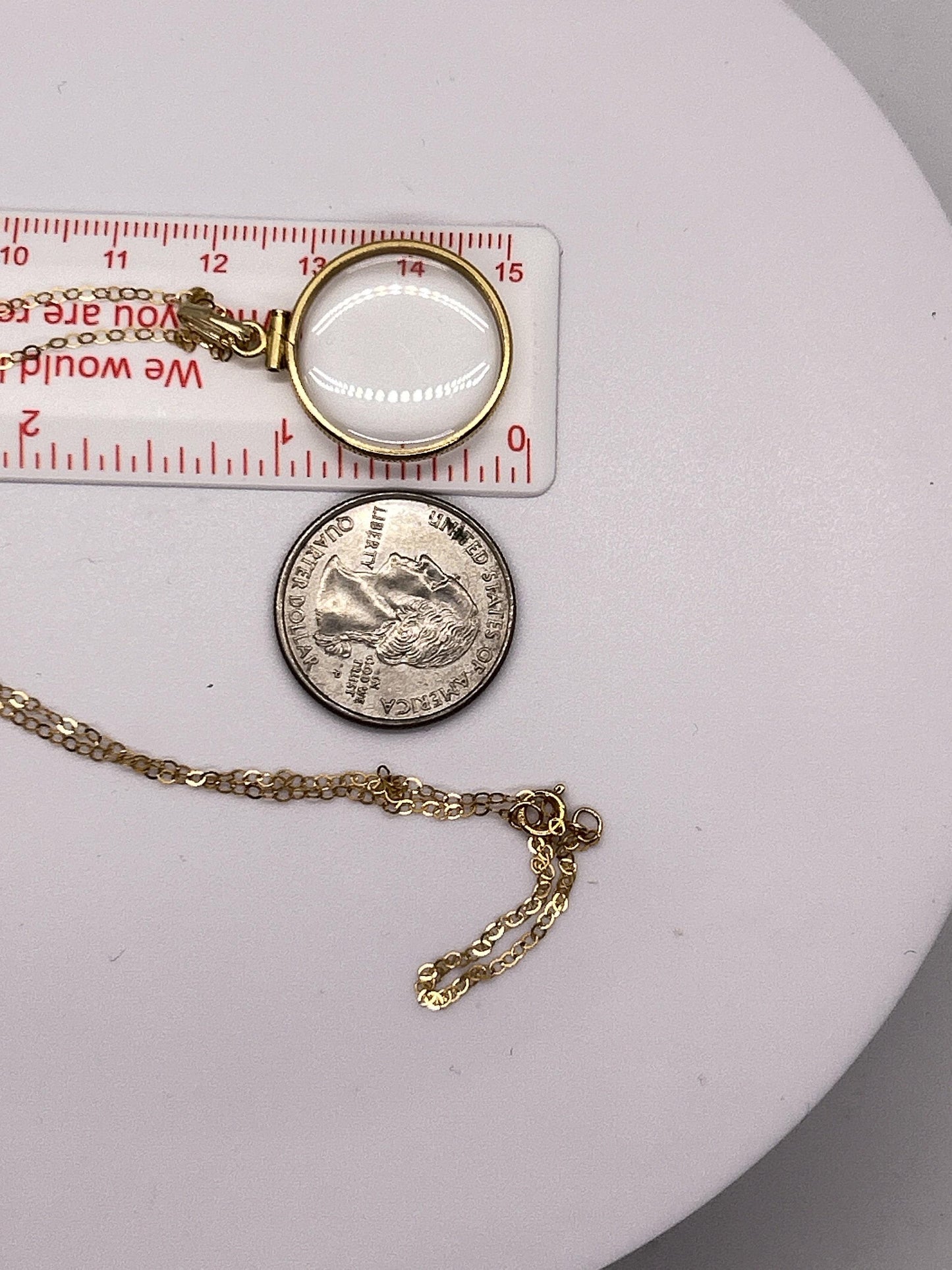 21.5mm solid gold shaker locket detail
