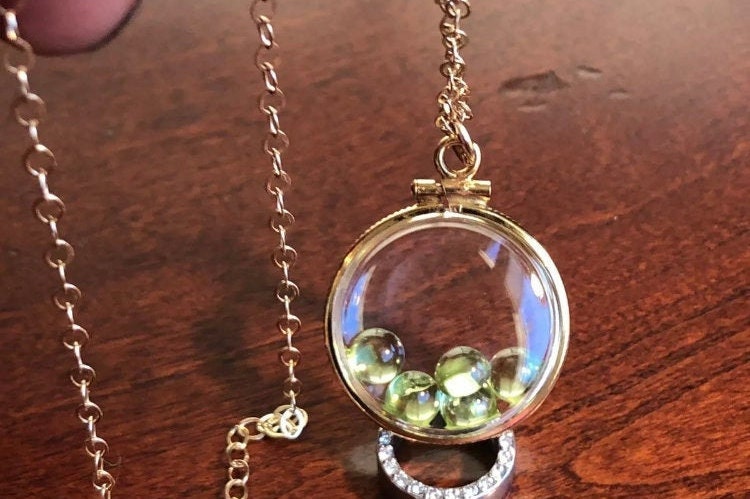 Vintage 12k gold filled locket with five 5mm beautiful green peridot cabochons, 3.26 TCW