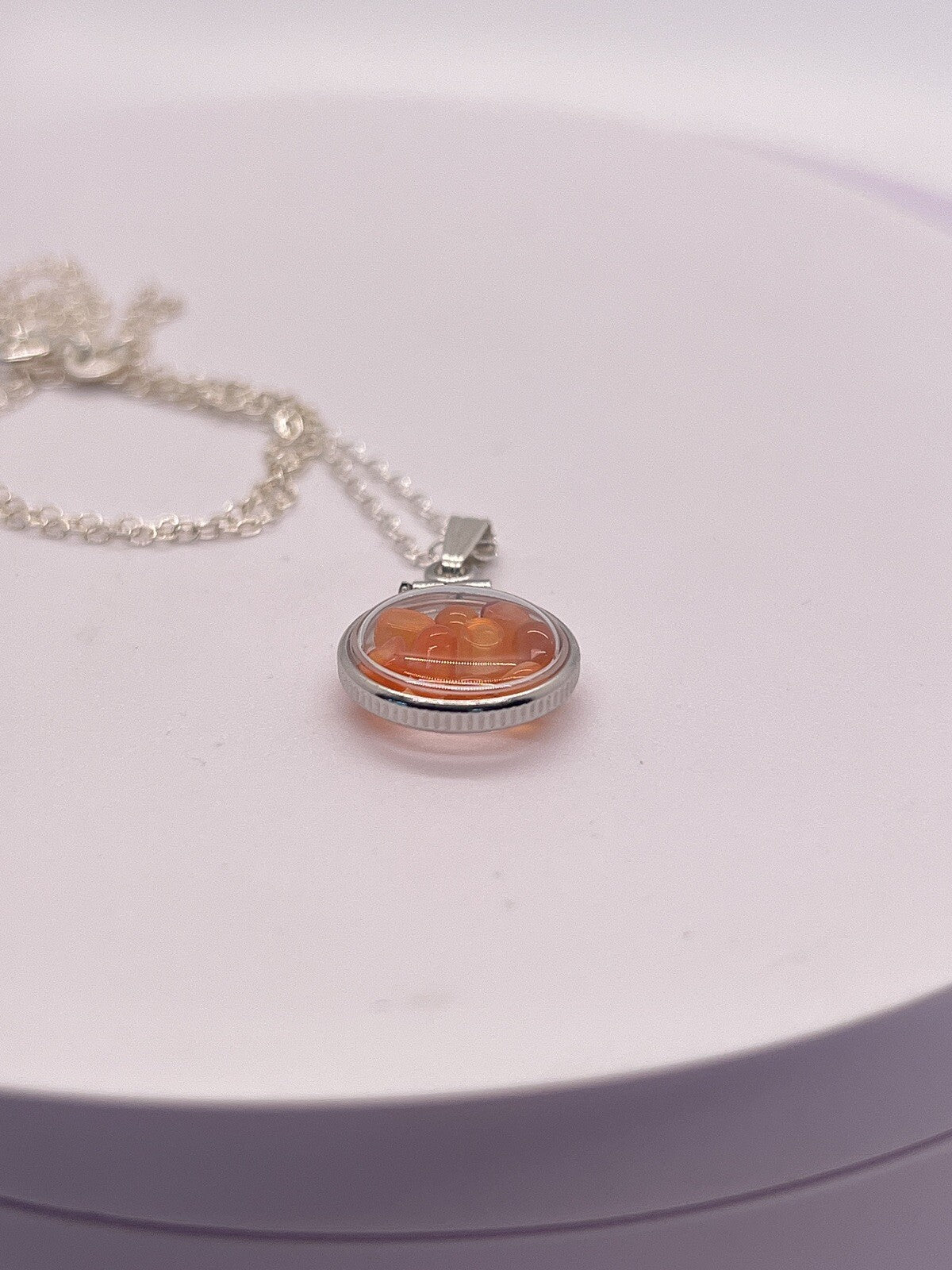 Diminutive Silver Carnelian Shaker Locket Lucite, natural orange cabs. 1.25 TCW
