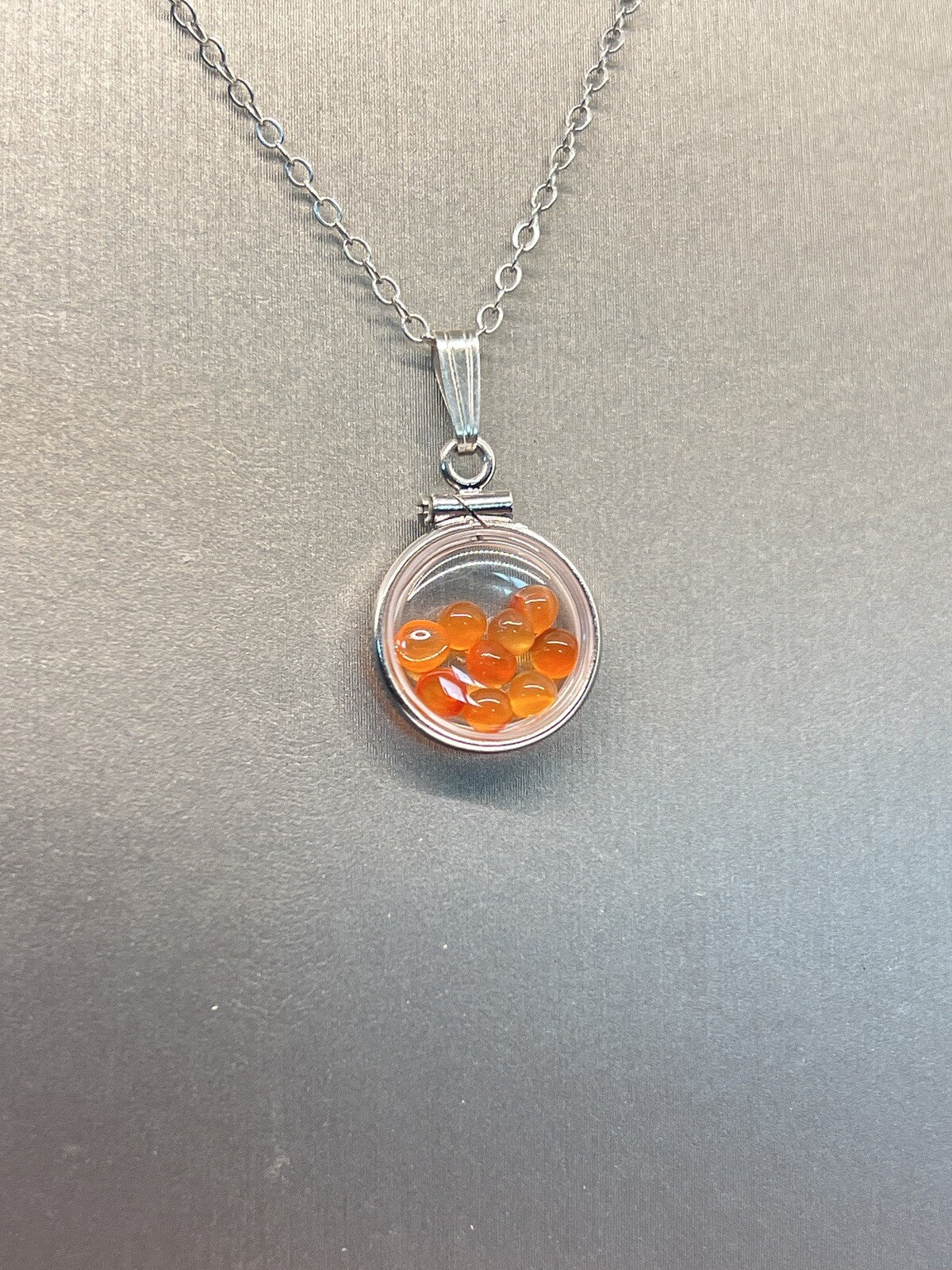 Diminutive Silver Carnelian Shaker Locket Lucite, natural orange cabs. 1.25 TCW
