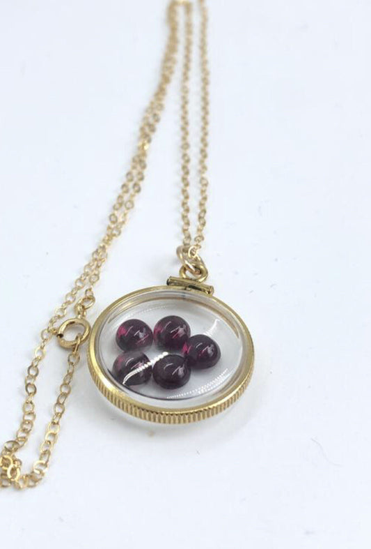 Vintage 12k gold filled locket with floating 5 beautiful Garnet cabochons 4 TCW