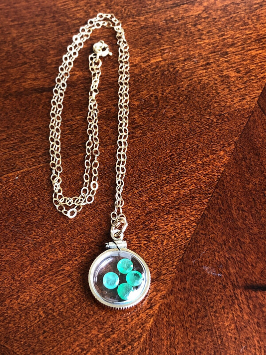 Vintage 12k gold filled locket with beautiful faceted genuine Emeralds.