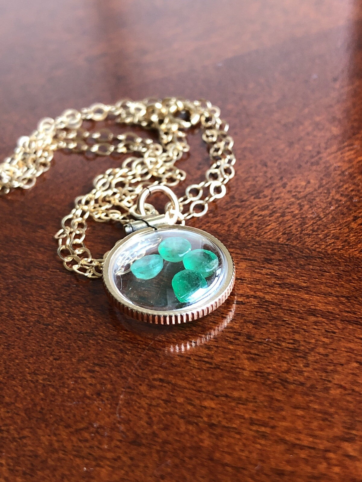 Vintage 12k gold filled locket with beautiful faceted genuine Emeralds.