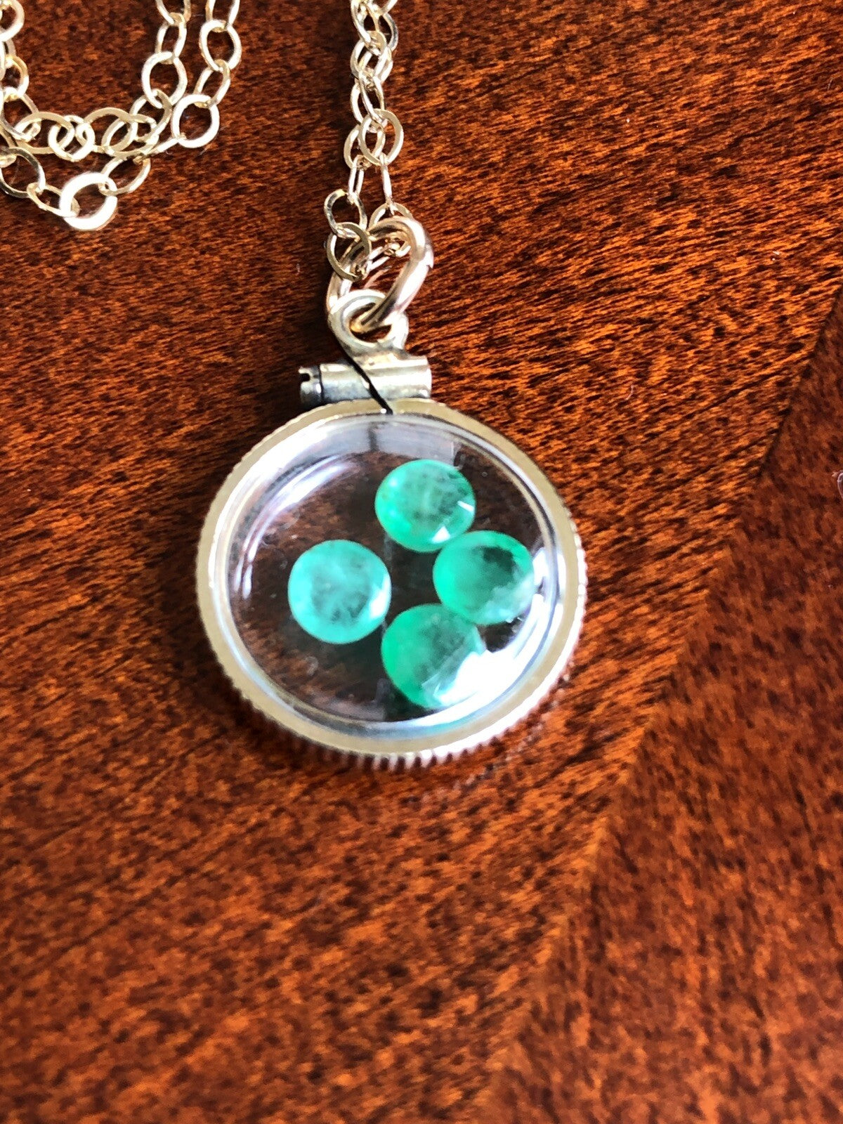 Vintage 12k gold filled locket with beautiful faceted genuine Emeralds.