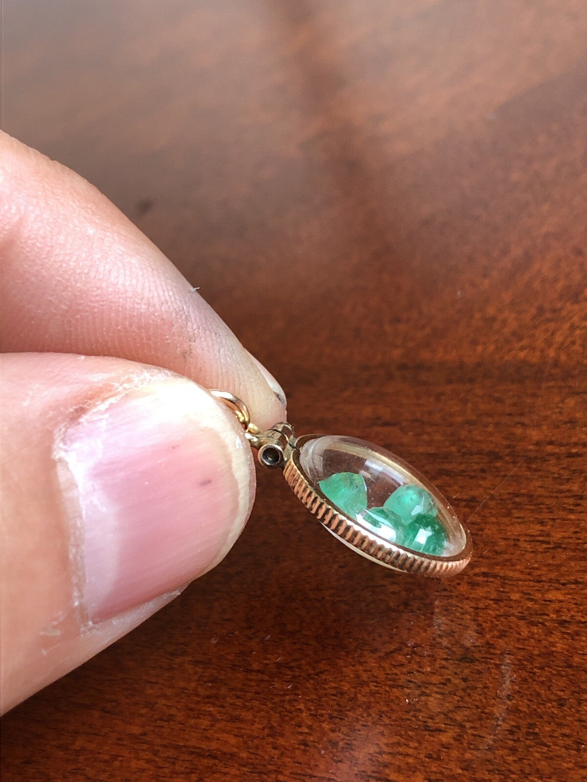 Vintage 12k gold filled locket with beautiful faceted genuine Emeralds.