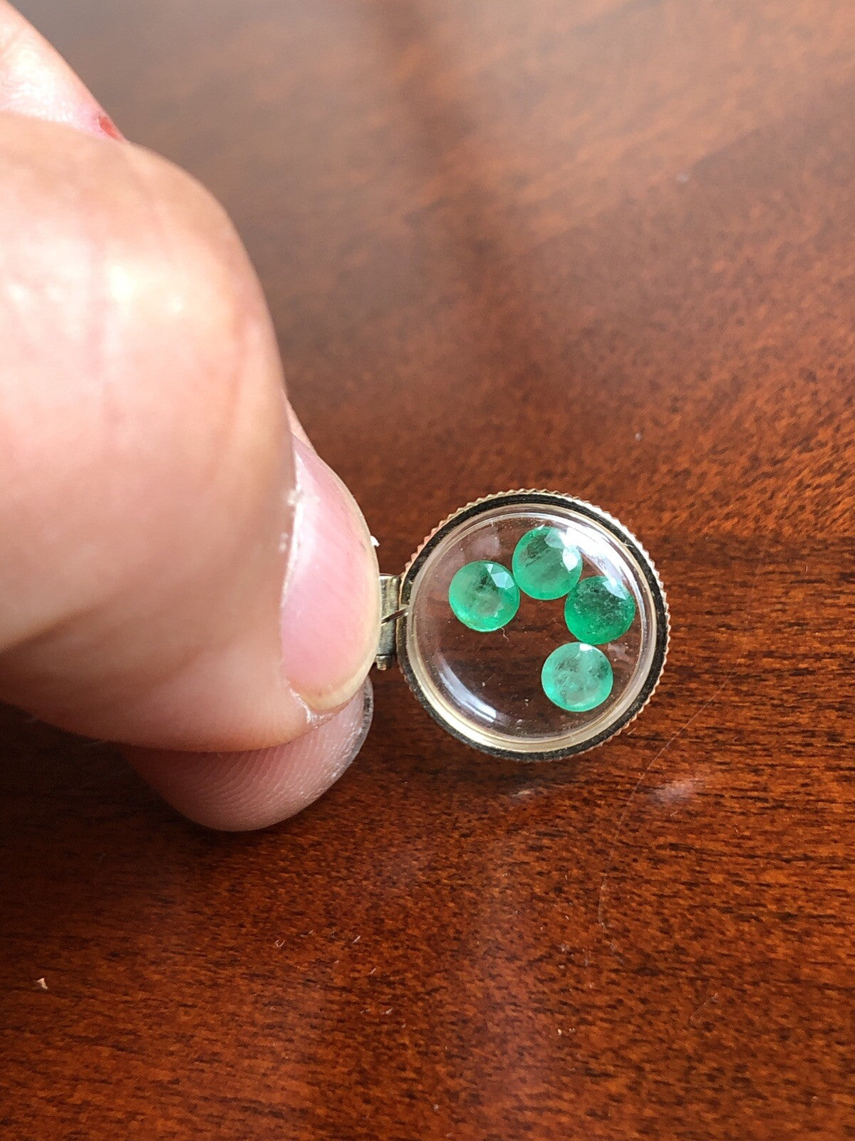Vintage 12k gold filled locket with beautiful faceted genuine Emeralds.