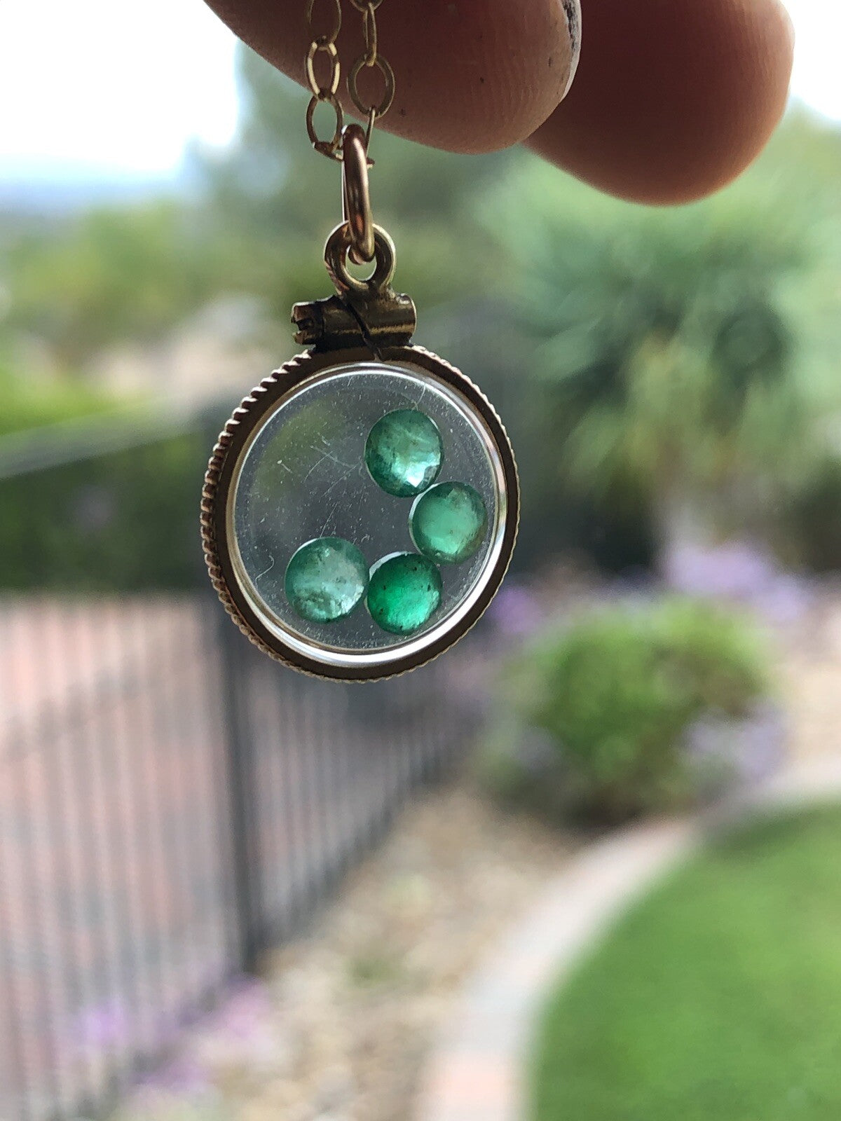 Vintage 12k gold filled locket with beautiful faceted genuine Emeralds.