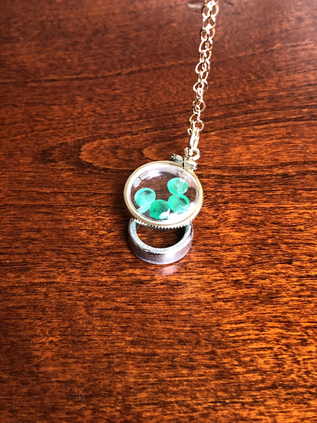 Vintage 12k gold filled locket with beautiful faceted genuine Emeralds.