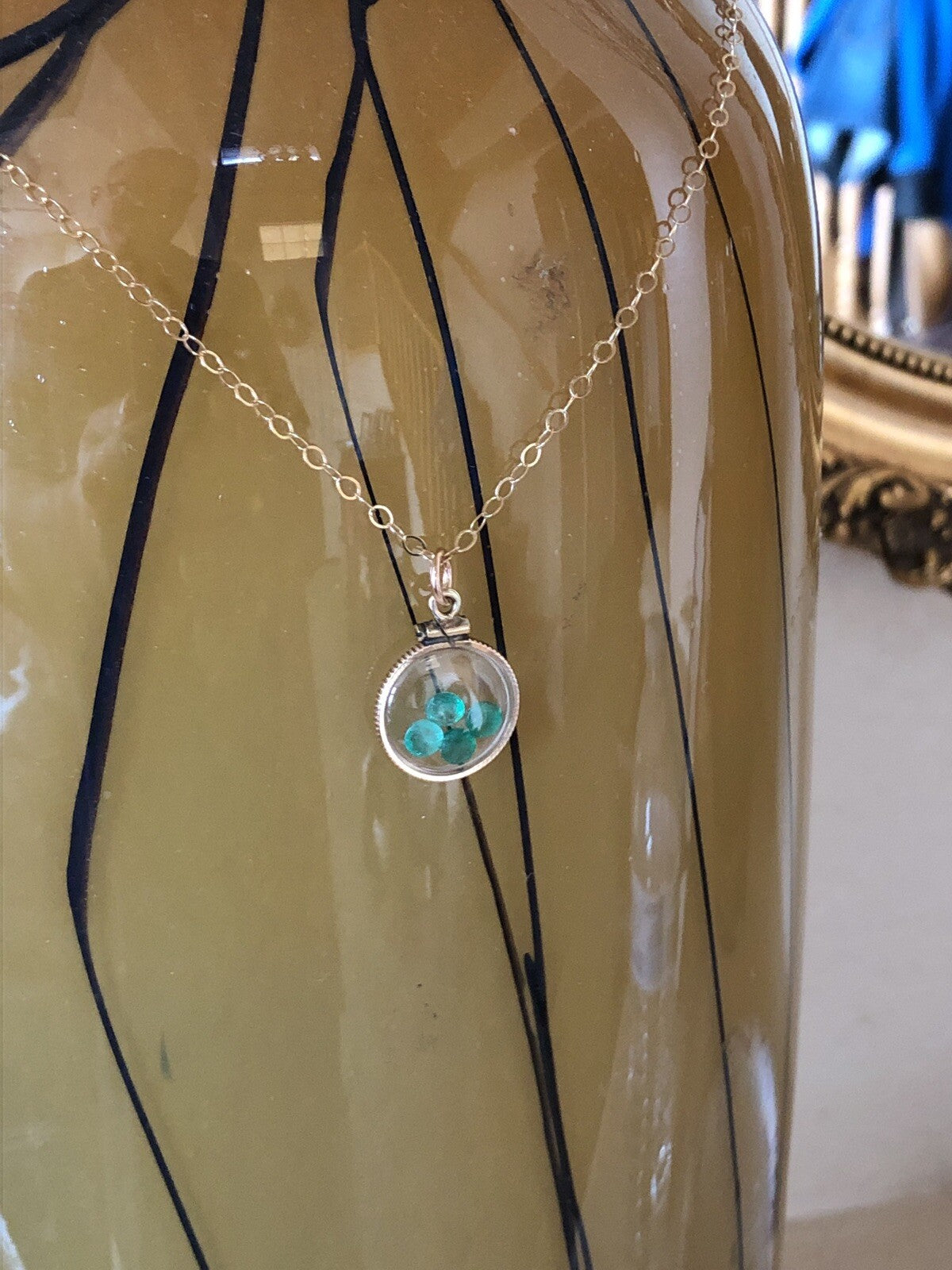 Vintage 12k gold filled locket with beautiful faceted genuine Emeralds.