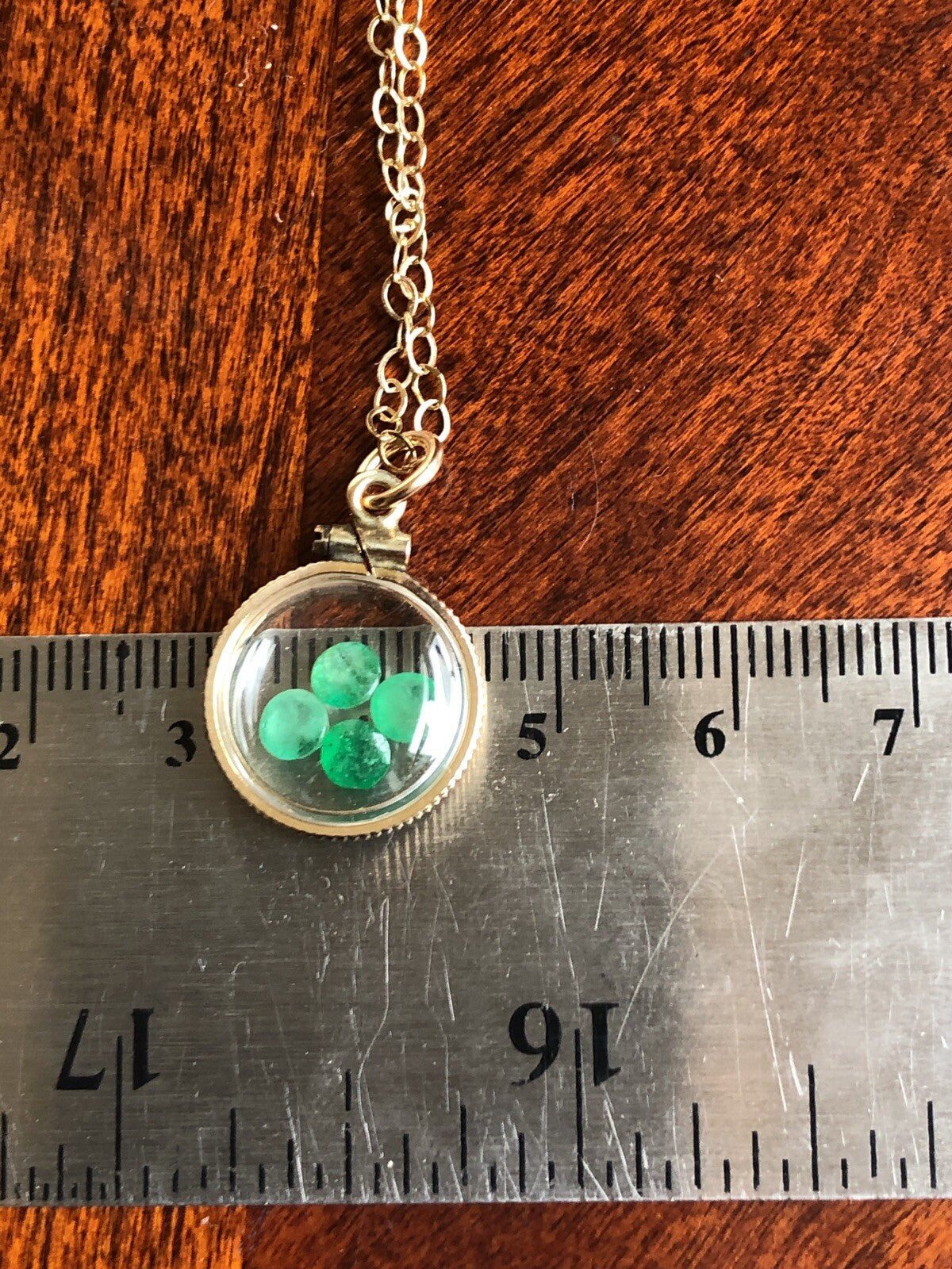 Vintage 12k gold filled locket with beautiful faceted genuine Emeralds.