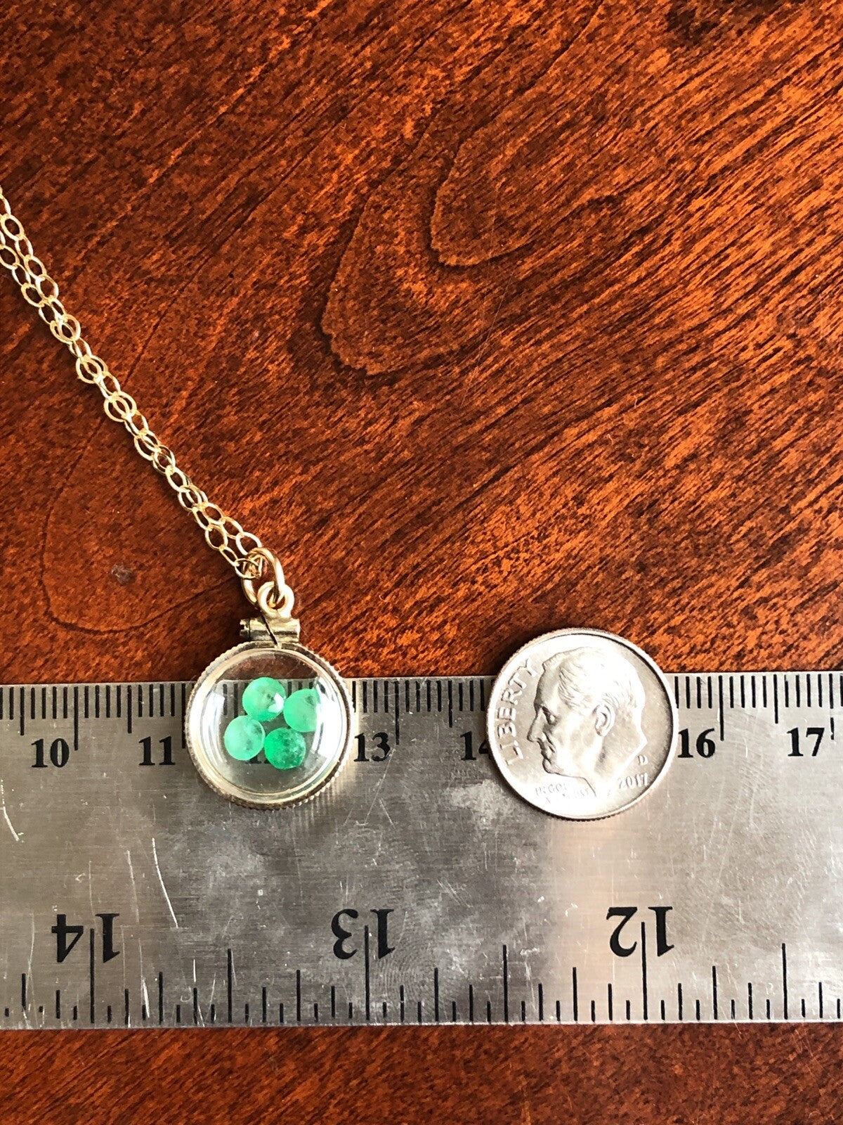 Vintage 12k gold filled locket with beautiful faceted genuine Emeralds.