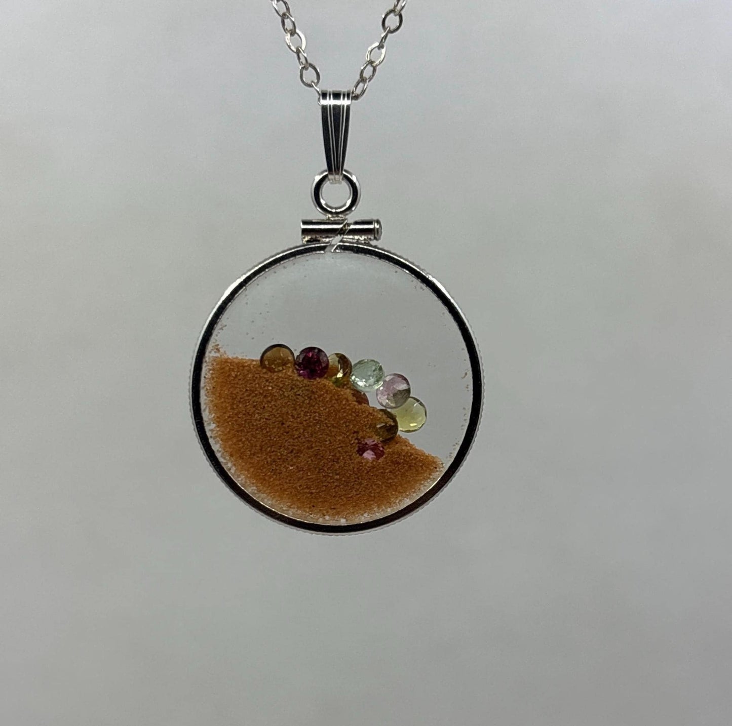Multicolor Tourmaline Shaker locket W/ Pink Coral Sand in Sterling Silver coin edge bezel, peek a boo gems. Unique.