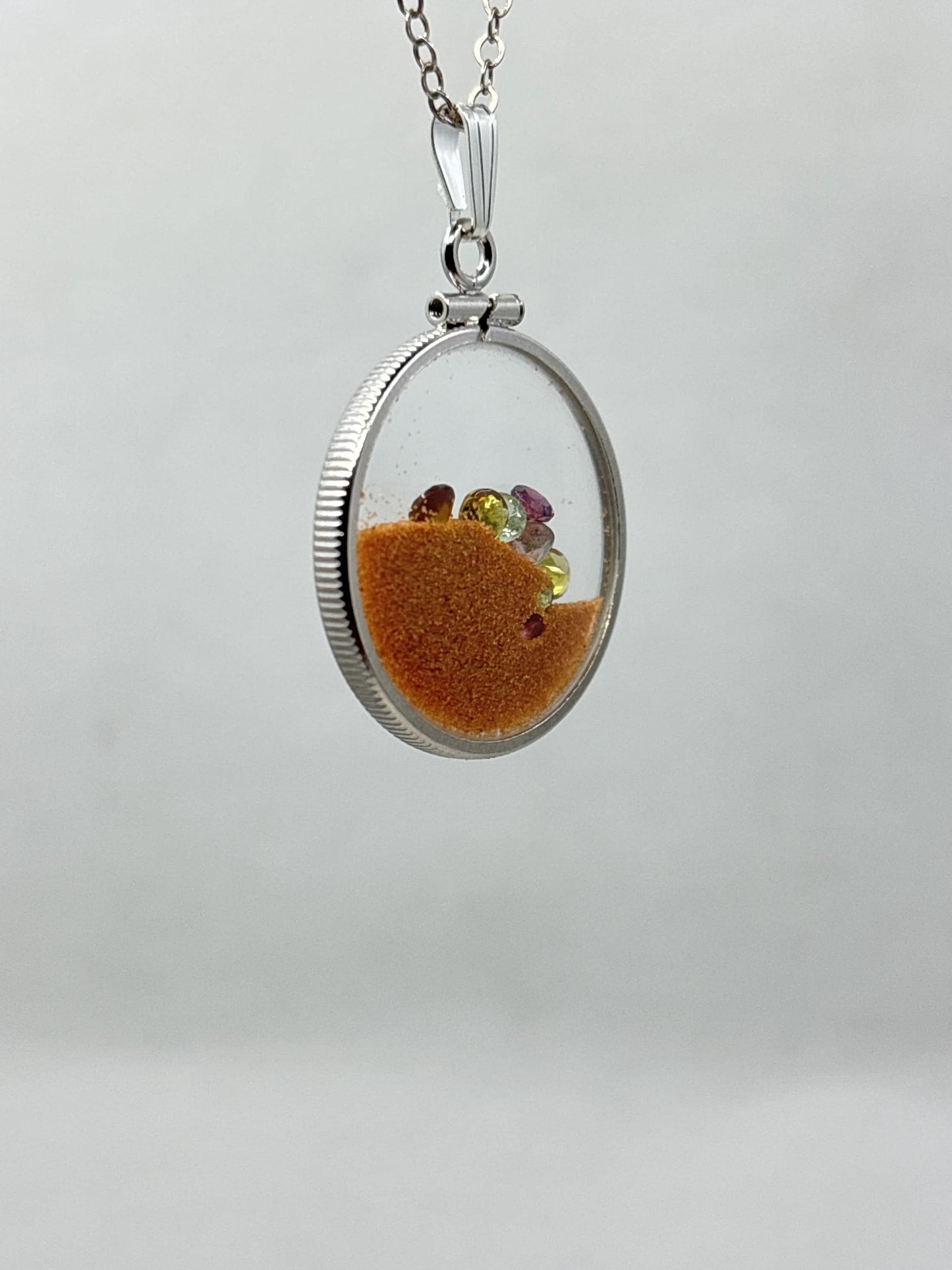 Multicolor Tourmaline Shaker locket W/ Pink Coral Sand in Sterling Silver coin edge bezel, peek a boo gems. Unique.