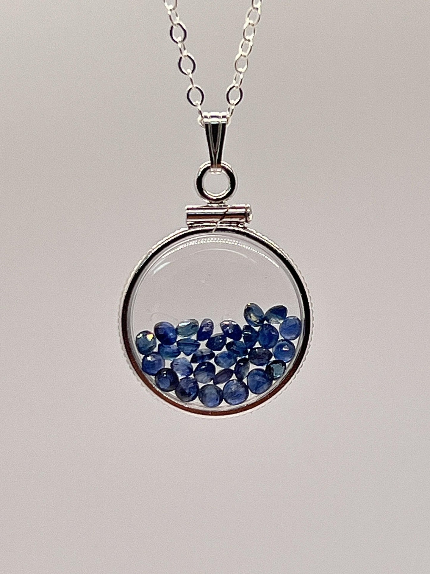 Handmade dime size sterling silver sapphire shaker locket lucite view locket, necklace, beautiful september birthstone. 2.5 tcw