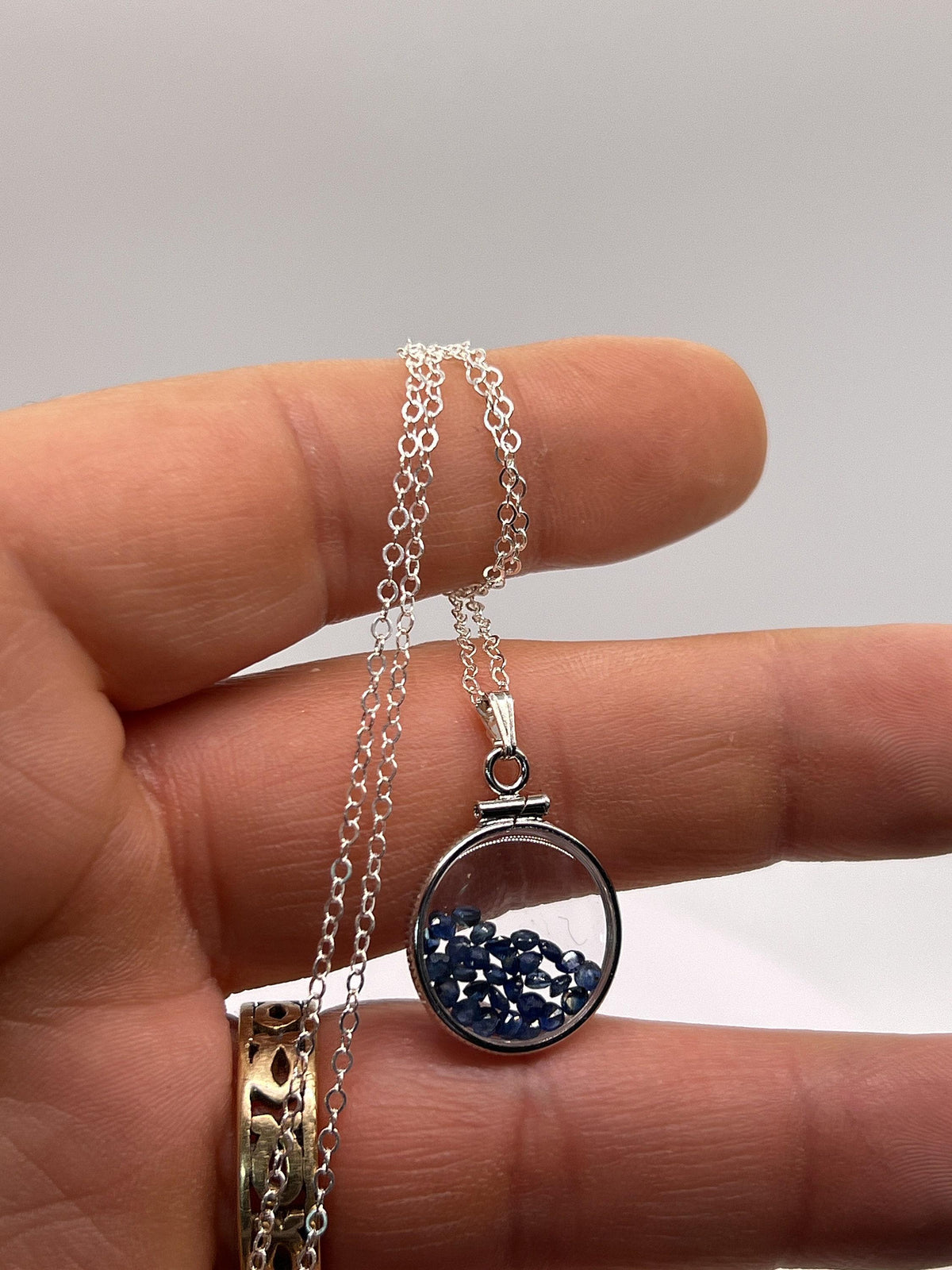 Handmade dime size sterling silver sapphire shaker locket lucite view locket, necklace, beautiful september birthstone. 2.5 tcw