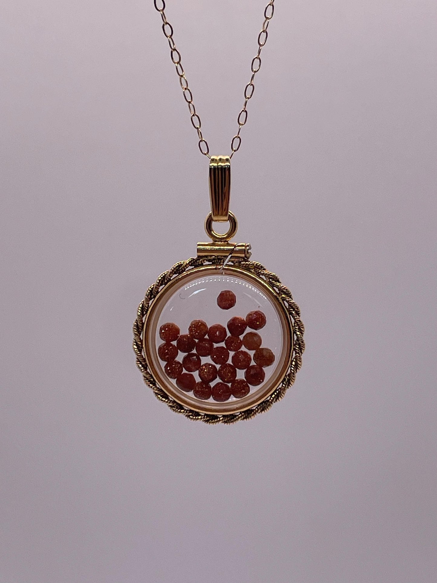 Hand made 21 mm nickel size 14k gold filled lucite genuine golden sandstone shaker locket with rope edge and beautiful bead crystals.
