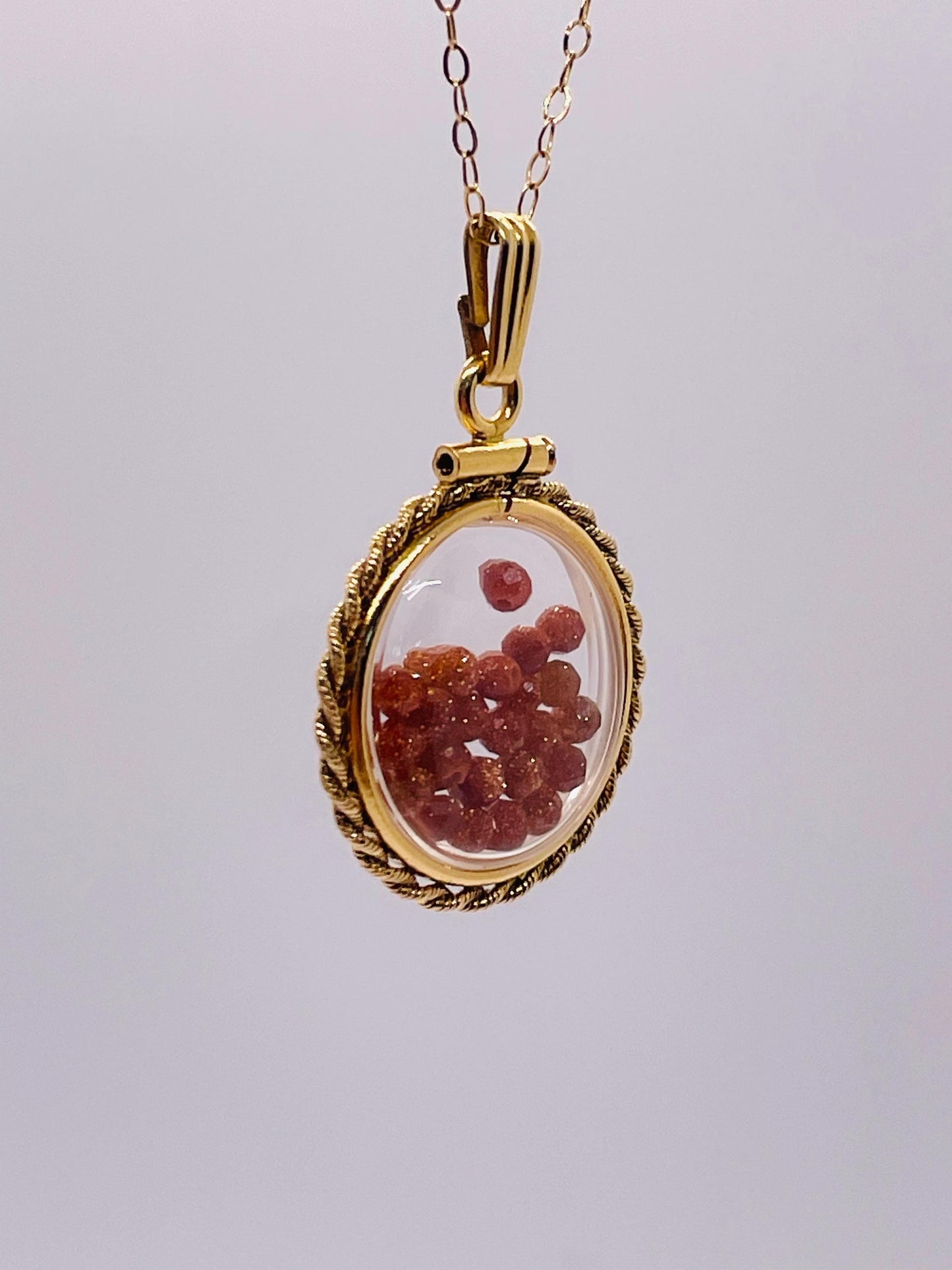 Hand made 21 mm nickel size 14k gold filled lucite genuine golden sandstone shaker locket with rope edge and beautiful bead crystals.