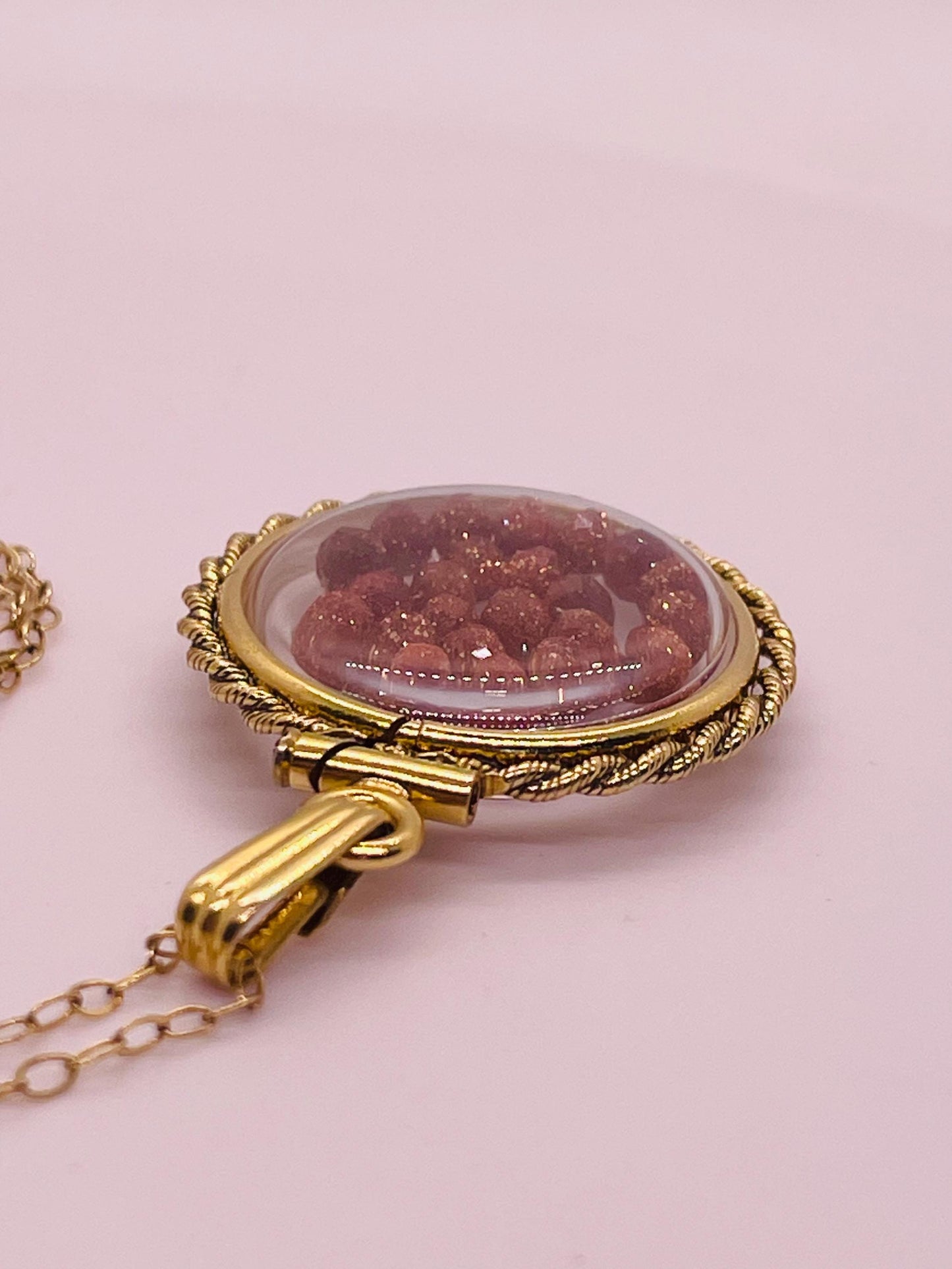 Hand made 21 mm nickel size 14k gold filled lucite genuine golden sandstone shaker locket with rope edge and beautiful bead crystals.