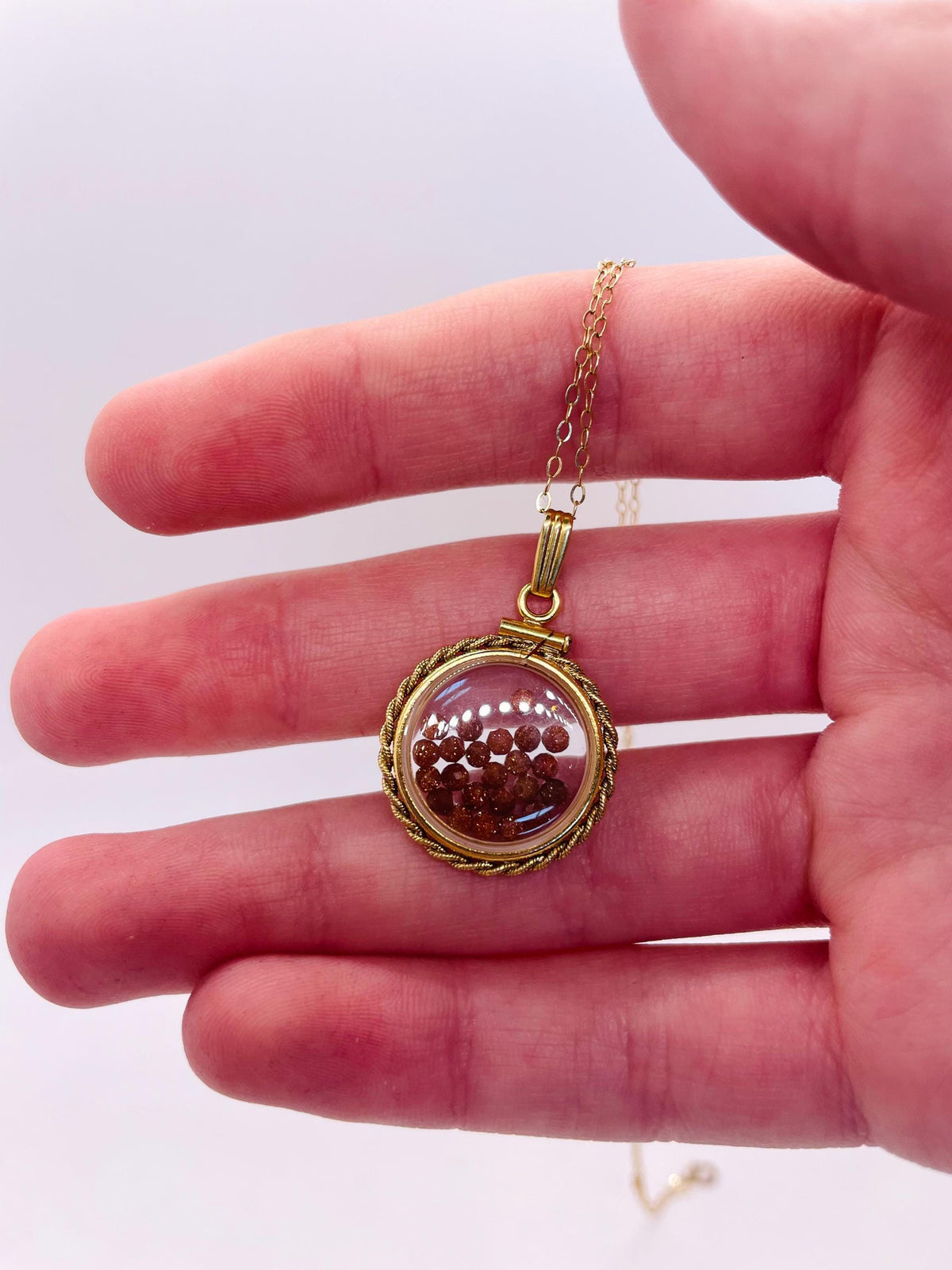 Hand made 21 mm nickel size 14k gold filled lucite genuine golden sandstone shaker locket with rope edge and beautiful bead crystals.