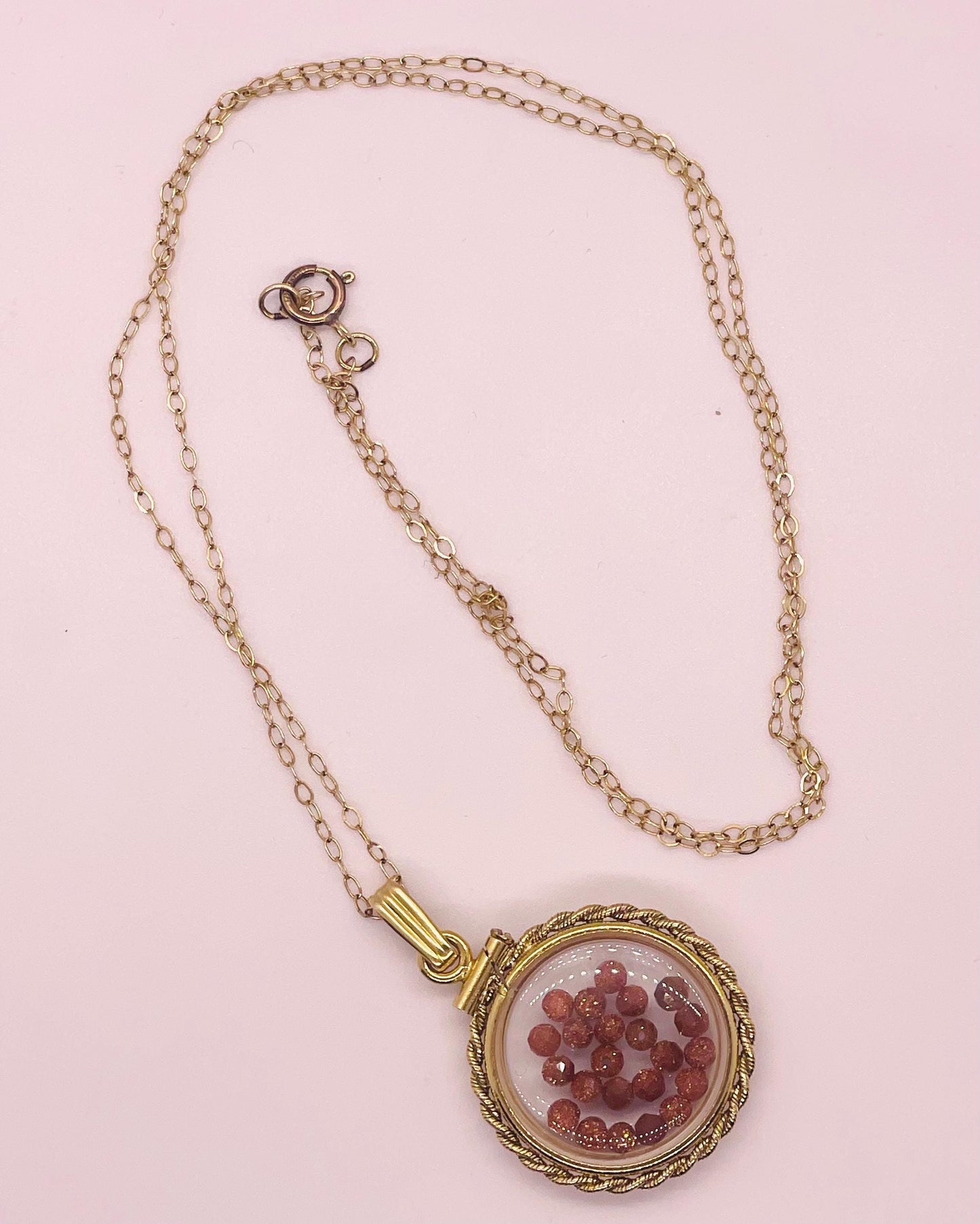 Hand made 21 mm nickel size 14k gold filled lucite genuine golden sandstone shaker locket with rope edge and beautiful bead crystals.