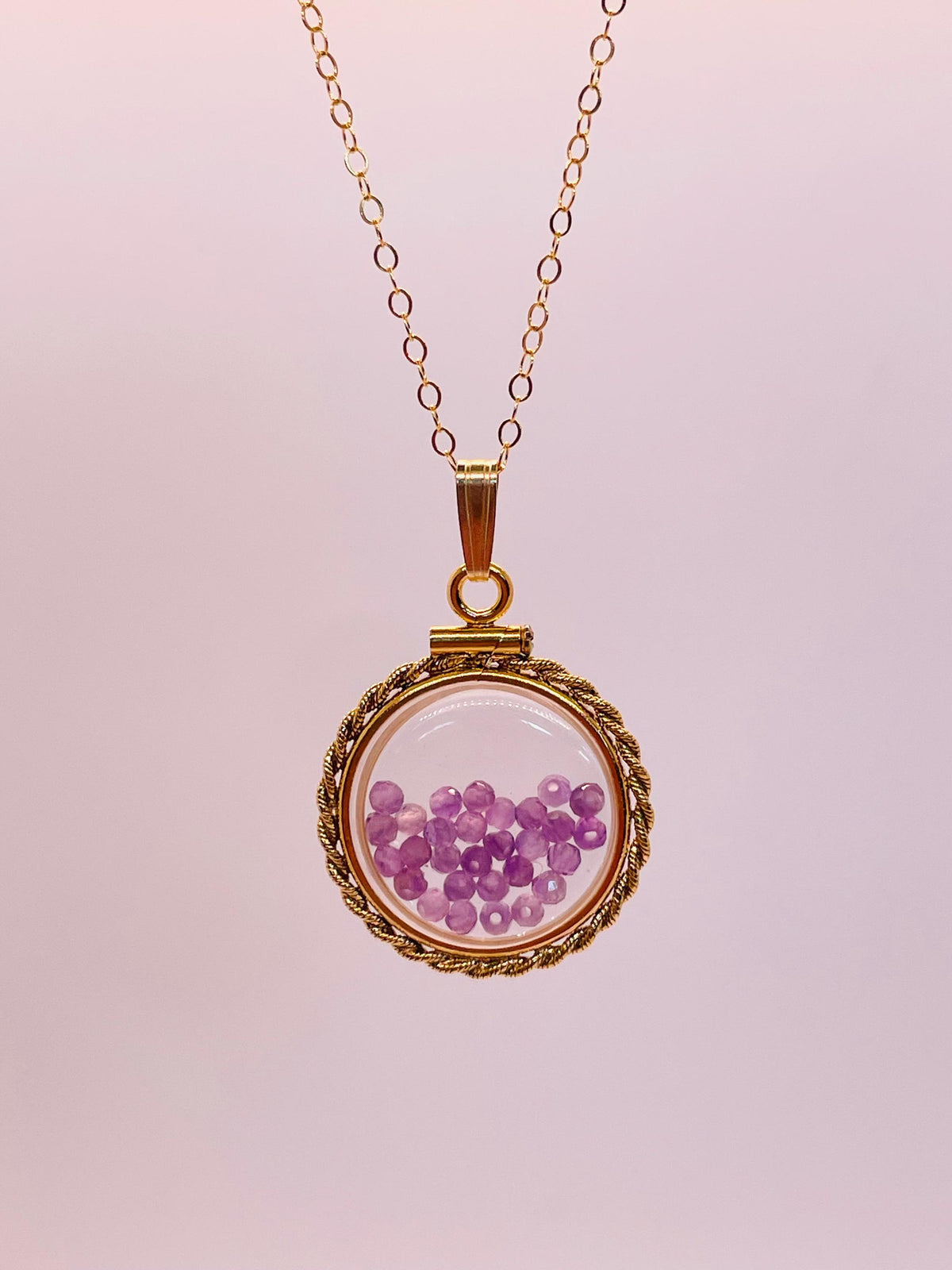 Hand made 21 mm nickel size 14k gold filled lucite genuine amethyst shaker locket with rope edge and beautiful bead crystals.