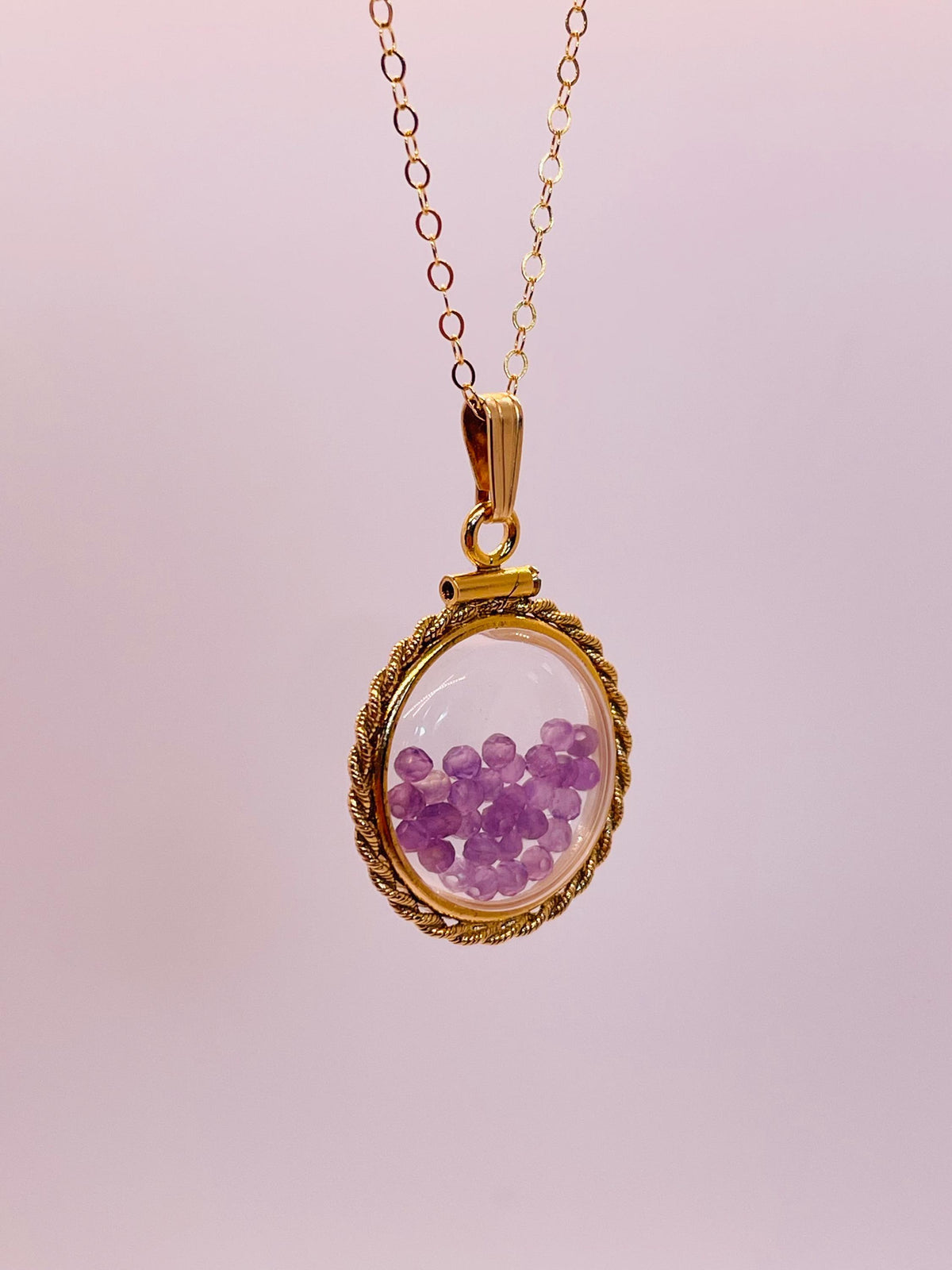 Hand made 21 mm nickel size 14k gold filled lucite genuine amethyst shaker locket with rope edge and beautiful bead crystals.