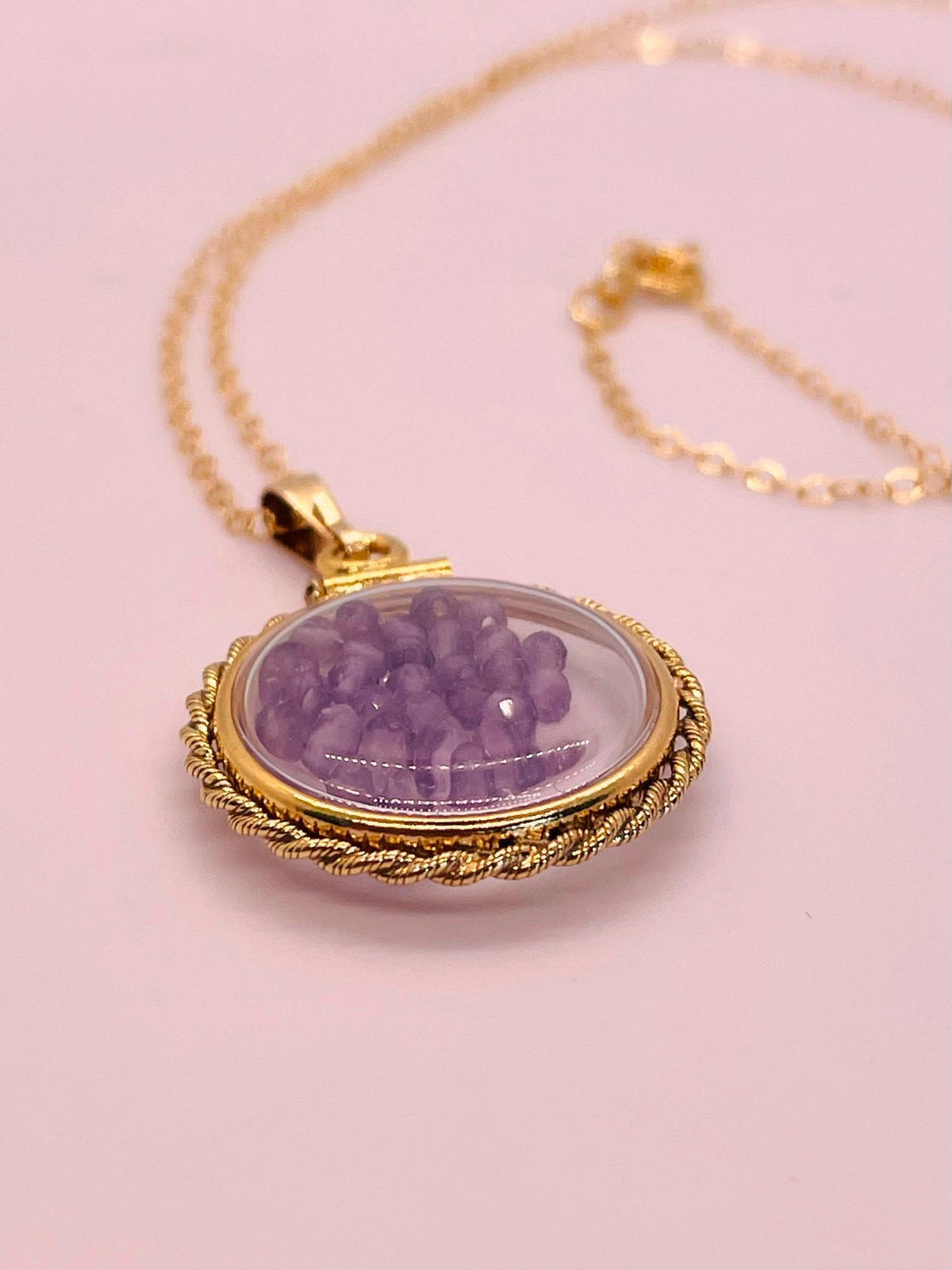 Hand made 21 mm nickel size 14k gold filled lucite genuine amethyst shaker locket with rope edge and beautiful bead crystals.