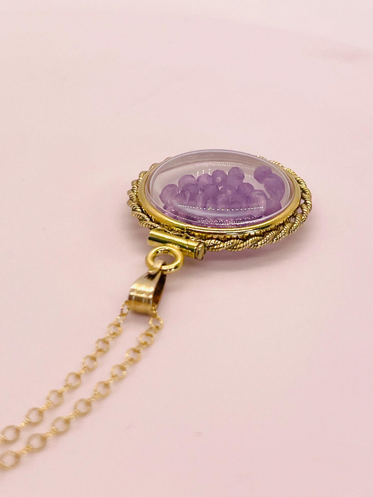 Hand made 21 mm nickel size 14k gold filled lucite genuine amethyst shaker locket with rope edge and beautiful bead crystals.